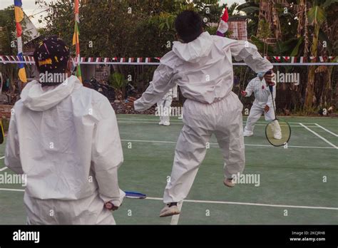 Residents Playing Badminton Wearing Hazmat Suits To Commemorate Th