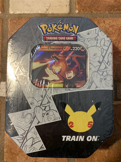 Pokemon TCG Celebrations Lance S Charizard V 25th Anniversary Tin