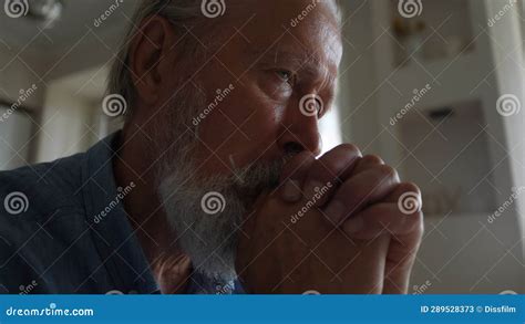 Closeup Low Angle View Of Depressed Mature Hoary Man Crying Feeling