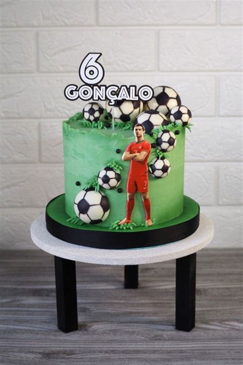 There Is A Cake With Soccer Decorations On It