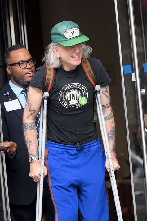 Daniel Day Lewis Pictured Using Crutches In Rare Outing