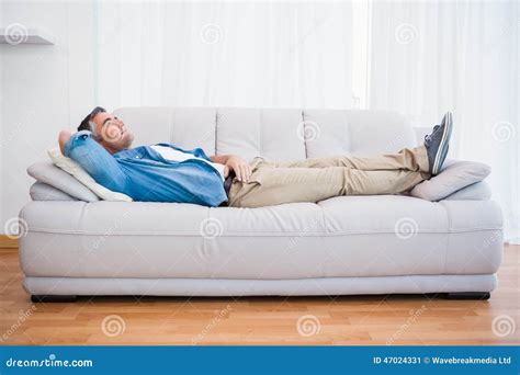 Smiling Man Lying And Relaxing On The Couch Stock Image Image Of Apartment Mature