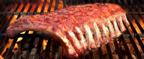 BBQ Baby Back Pork Ribs On The Hot Flaming Grill Stock Photo Image Of Meat Fire