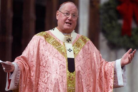 Cardinal Dolan Welcomes Refugees At Midnight Mass