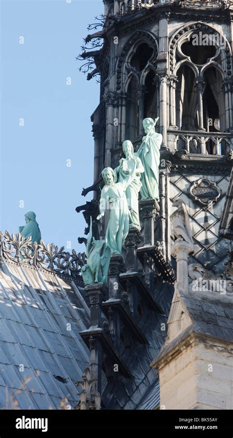 Statues Of Three Apostles At The Foot Of Notre Dame De Paris Cathedral Spire Paris Ile De