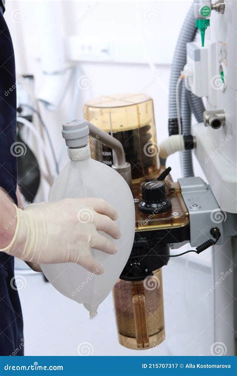 The Resuscitator Checks And Connects The Device For Artificial