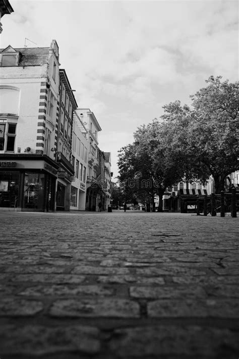 Black And White Shot Of Norwich City Centre With A Cobblestone Street