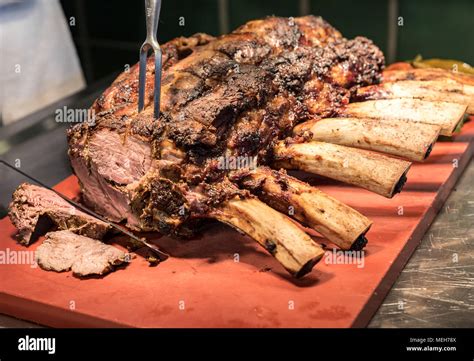 Chef Carving Prime Rib Of Roast Wagyu Beef Stock Photo Alamy