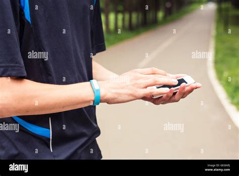 Man Use Mobile Phone Sync With Activity Tracker Stock Photo Alamy