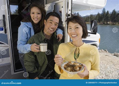 Mom With Her Daughter Eating Chocolate Flakes Have A Good Time