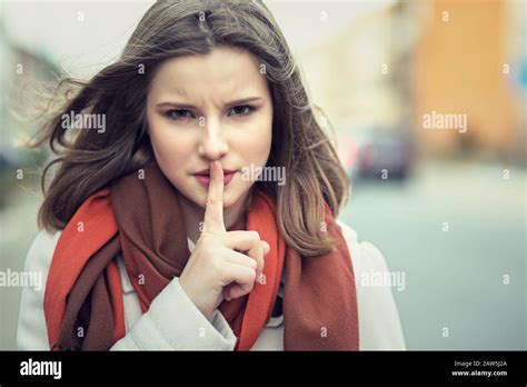 Shh Woman Wide Eyed Asking For Silence Or Secrecy With Finger On Lips