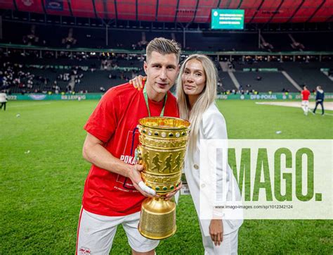 Leipzigs Willi Orban And His Girlfriend Present The Trophy After The