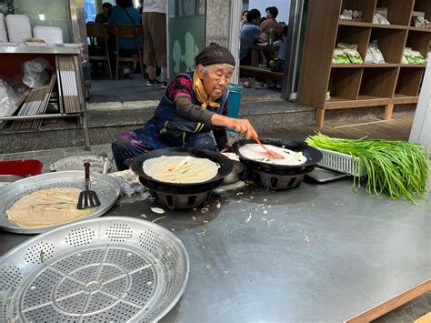Elderly Woman Cooking Traditional Food · Free Stock Photo