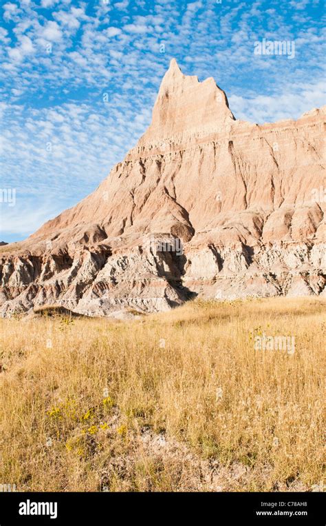 Sculpted Spires Rise Above Prairie Grasslands In Badlands National Park