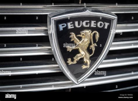 Peugeot logo on vintage car Stock Photo - Alamy