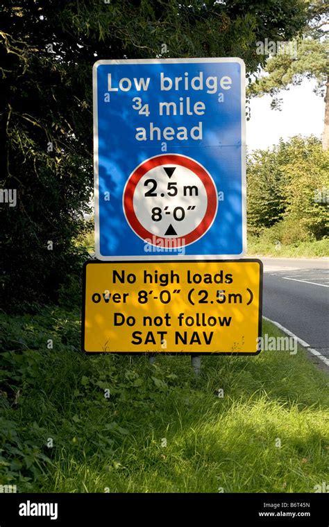 Road Sign Warning Of A Low Bridge Ahead And Instructing Not To Follow