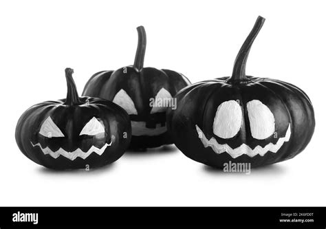 Black Halloween pumpkins with drawn face on white background Stock ...