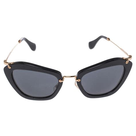 Miu Miu Goldblack Smu 10n Cat Eye Sunglasses At 1stdibs