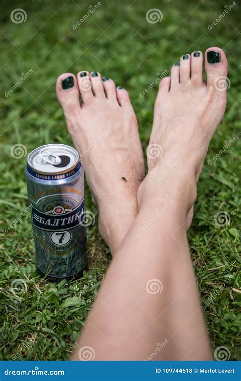 Women Feet And Can Of Baltika Beer Editorial Stock Photo Image Of