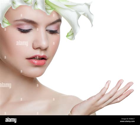 Spa beauty. Young woman with white flower isolated on white background ...