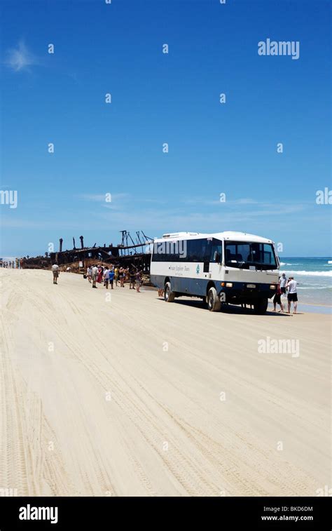 A Fraser Island Explorer Tour Bus Visits The Wreck Of The Ss Maheno On