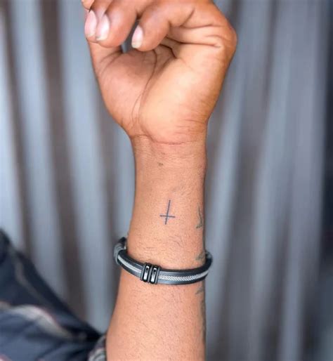 46 Faithful Cross Tattoos On Wrist To Get In 2024