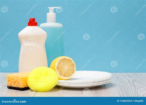 Bottles Of Dishwashing Liquid And Utensil On A Pink Background Stock