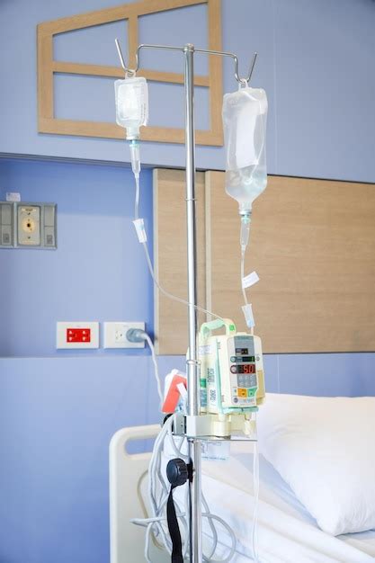 Premium Photo Iv Drip Chamber And Iv Bag Of Solution With Patient On