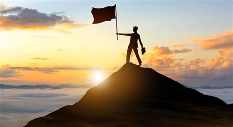 Businessman With Flag On Top Of Mountain Success Achieving Goal