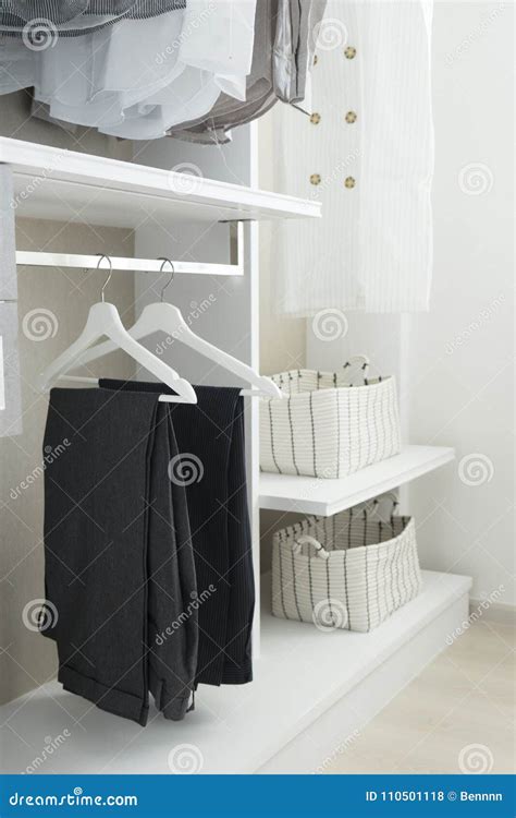 Modern Closet With Row Of Pants Hanging Stock Photo Image Of Clothes