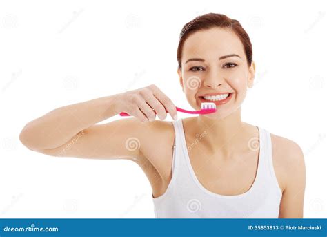 Beautiful Woman In White Top Is Brushing Her Teeth Stock Image Image