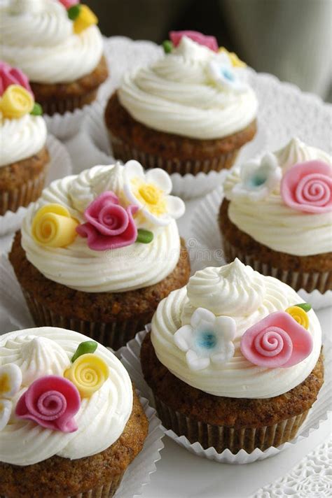 Cupcakes with Fondant Flowers Stock Photo - Image of decorating, bright ...