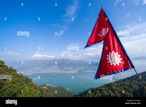 Nepali National Flag Waving High Above The Phewa Lake And Pokhara