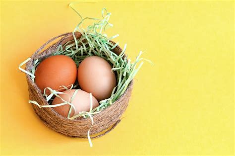 Premium Photo Wicker Basket With Easter Eggs