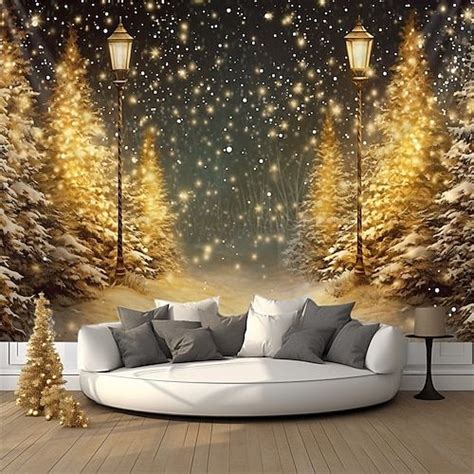 a living room with a couch and christmas trees on the wall in front of it