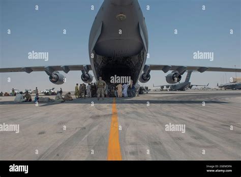 Qualified Evacuees Wait On The Flight Line As They Debark A C 17 Globemaster Lll Aug 20 2021