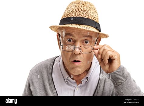 Surprised Mature Man Looking At The Camera Isolated On White Background