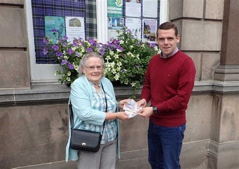 Moray MP hands over cash to pensioners | Douglas Ross