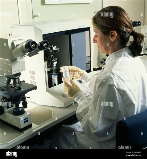 Technician Analysing Samples From Cervical Smear Tests A Sample Of