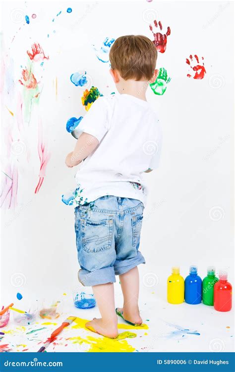 Child painting on the wall stock photo. Image of child - 5890006