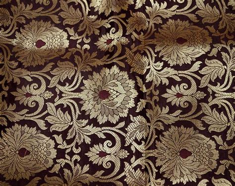 An Intricately Designed Brown And Gold Fabric