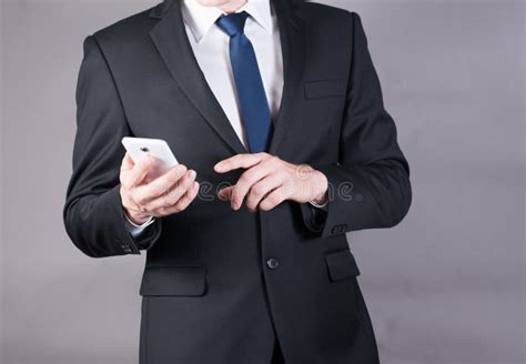 Closeup Of A Successful Businessman Using Mobile Smart Phone Stock