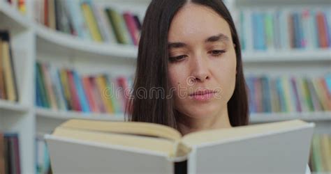 Beautiful Young Woman Reading Book In Library Of University Self