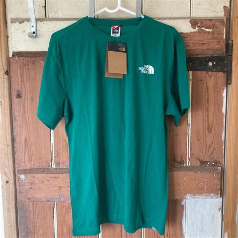 The North Face Mens Blue And Green T Shirt Depop