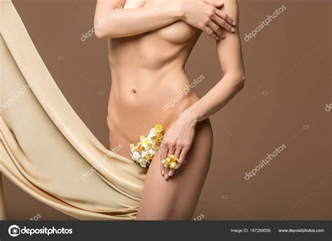 Beautiful Naked Woman With Flowers Between Legs And Silk Fabrics