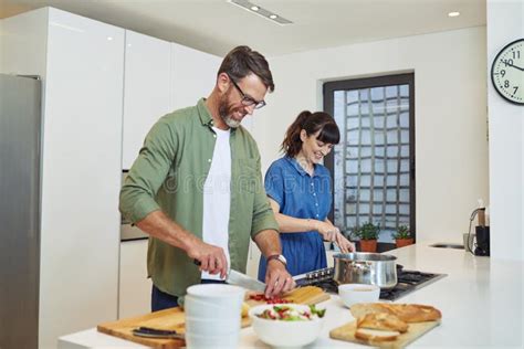 Theyre Master Chefs In The Kitchen A Mature Couple Cooking Together At Home Stock Photo