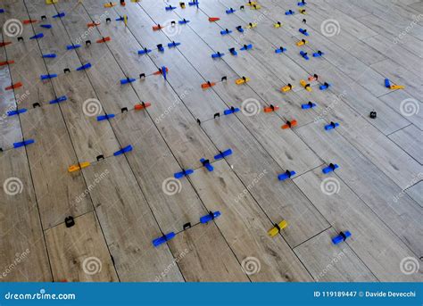 Installation of Wood-style Porcelain Tiles on a Floor Stock Image ...