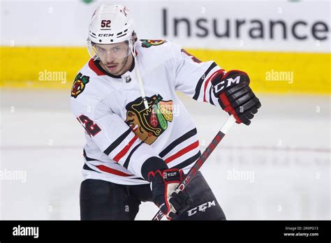 Nhl Profile Photo On Chicago Blackhawks Player Reese Johnson At A Game Against The Calgary