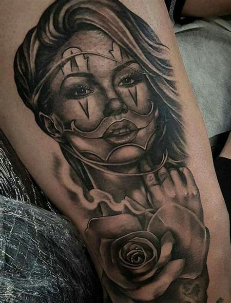 A Black And White Tattoo With A Woman Holding A Rose