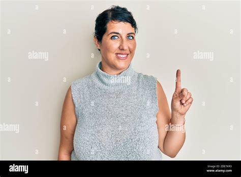 Plus Size Brunette Woman Wearing Casual Clothes Smiling With An Idea Or